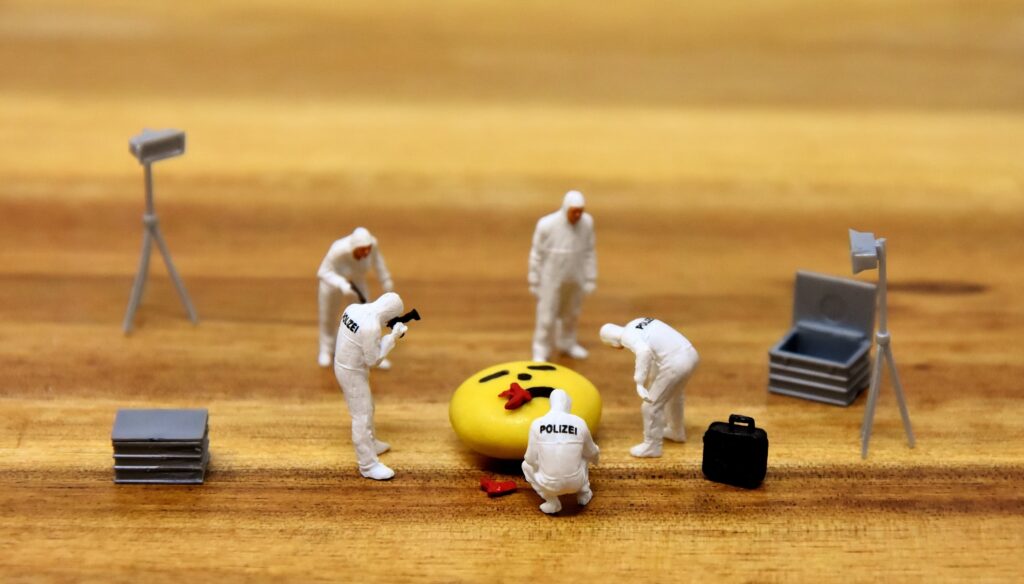 picture of crime scene made out of miniatures on top of a table
