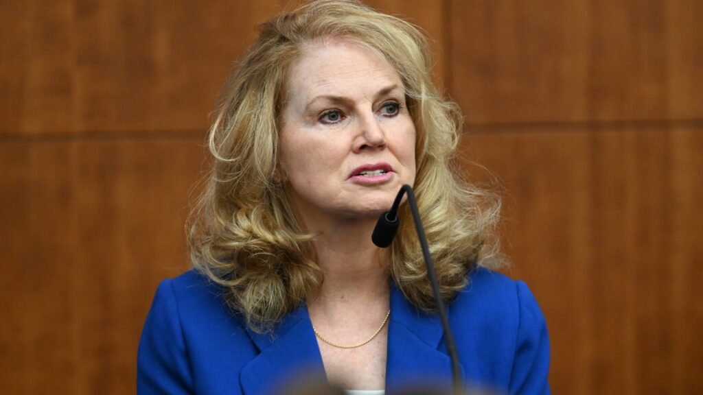 chaplain at Mass General Brigham wears a bright blue blazer to testify in the Lindsay Clancy murder trial