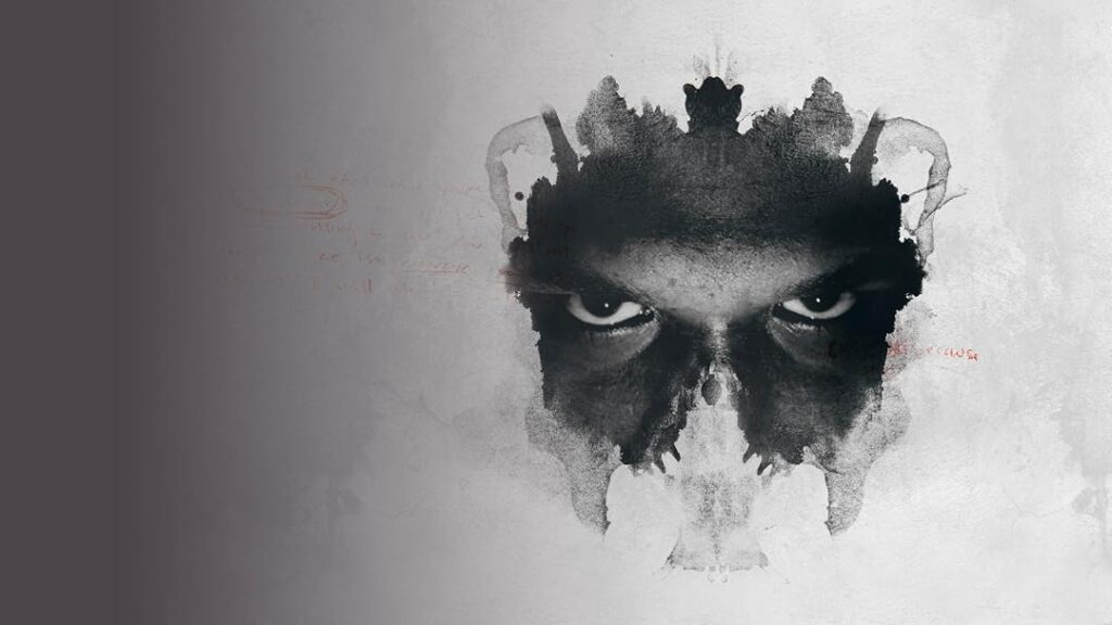 Promotional logo for Signs of a Psychopath featuring a black inkblot Rorschach test that resembles a human face.