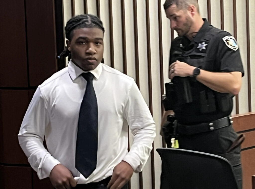 A courtroom photograph of Jayden Armez Shazier standing beside his defense attorney inside the Macomb County Circuit Court during his trial.